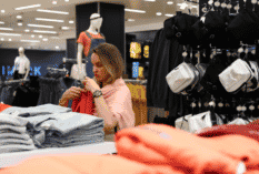 Female shopper in clothing store